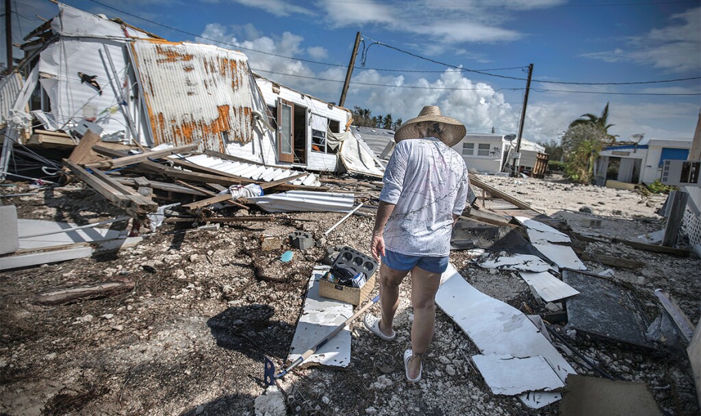 Photographs by Kadir van Lohuizen / NOOR / Redux. Sharon Noeller walks through Sea Breeze RV Park on Plantation Key after Hurricane Irma. She had lived there for 12 years.